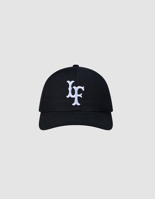 The LFDY Snapback by LIVE FAST DIE YOUNG features a black design, curved brim, white embroidered multi-logo on the front, and an adjustable snap closure. Shown against a plain light gray background. ONE SIZE fits most.