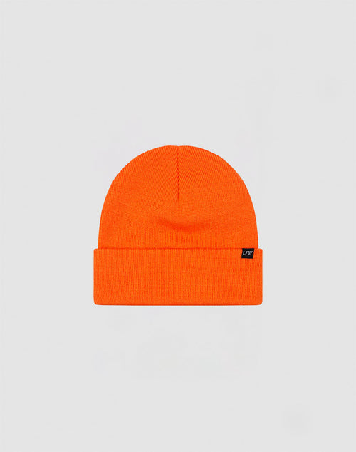 The LIVE FAST DIE YOUNG Basic Beanie is a bright orange, one size knit hat with a folded brim and small black flaglabel on the left, made from soft polyacryl and shown against a plain light grey background.