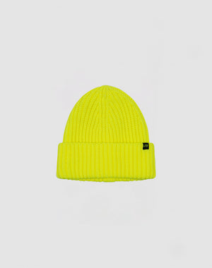 The Rib Knit Beanie by LIVE FAST DIE YOUNG is a bright yellow Polyacryl hat in ribbed knit, with a folded brim and a small black side tag, shown on a plain light grey background.