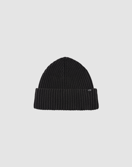 A black LFDY Rib Knit Beanie in One Size, made from soft Polyacryl, is displayed on a plain light gray background. The beanie features a folded cuff with a small, subtle LFDY tag.