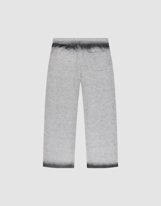 The Live Fast Boucle Pants by LIVE FAST DIE YOUNG are gray wide-leg knit pants with an elastic waistband, high waist, straight leg, right back pocket, and darker gray gradient at the waistband and hems, shown flat on a light background.
