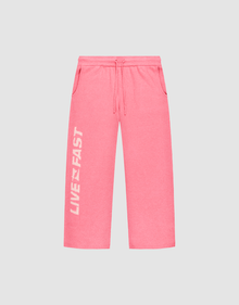 The Live Fast Boucle Pants by LIVE FAST DIE YOUNG feature a bright pink wide fit, elastic waistband, side pockets, and “LIVE FAST” in bold white text vertically on the left leg. | plain