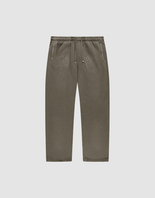 The LIVE FAST DIE YOUNG Live Fast Rhinestone Jogger, in olive green with an elastic waistband, drawstring, side pockets, and rhinestone detail, is shown laid flat on a plain light gray background. | plain