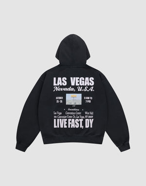 The Live Fast Vegas Hooded by LIVE FAST DIE YOUNG is a black oversize-fit hoodie with a cozy hood, front and back prints, bold white "LAS VEGAS Nevada, U.S.A." text, event details, and phrases like LIVE FAST, DY, and Convention Center. | plain