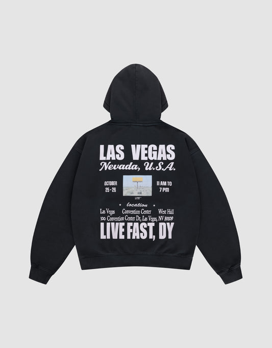 The Live Fast Vegas Hooded by LIVE FAST DIE YOUNG is a black oversize-fit hoodie with a cozy hood, front and back prints, bold white "LAS VEGAS Nevada, U.S.A." text, event details, and phrases like LIVE FAST, DY, and Convention Center. | plain