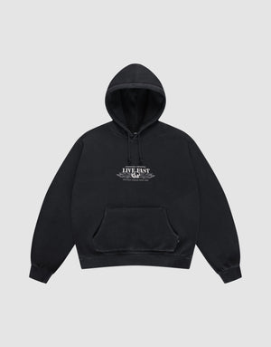 The Live Fast Corporation Hooded by LIVE FAST DIE YOUNG is a black sweatshirt in Vintage Waschung with an Oversize Fit, front pockets, and "LIVE FAST" text on the chest, shown against a plain light gray background. | plain