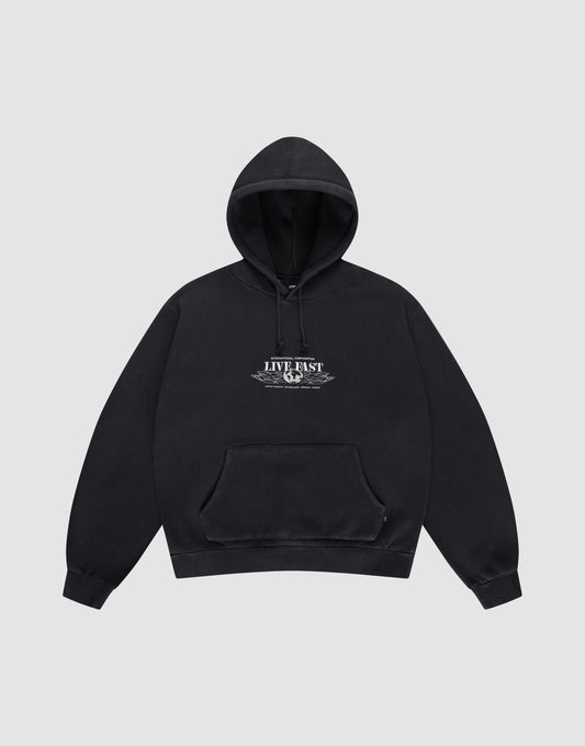 The Live Fast Corporation Hooded by LIVE FAST DIE YOUNG is a black sweatshirt in Vintage Waschung with an Oversize Fit, front pockets, and "LIVE FAST" text on the chest, shown against a plain light gray background. | plain
