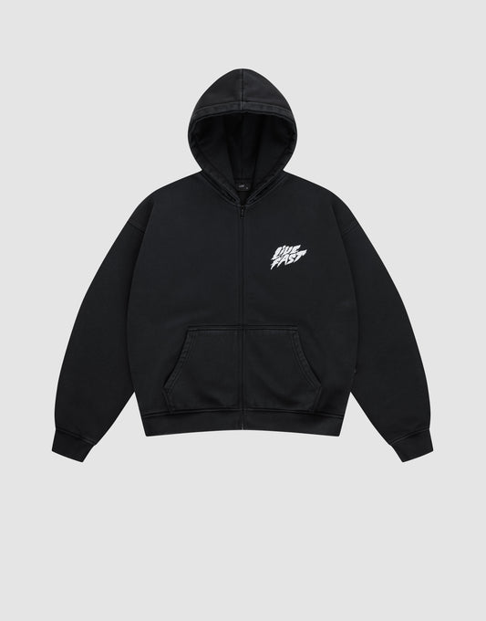 The LFDY Logo Hooded Zip by LIVE FAST DIE YOUNG is a black Oversize Fit zip-up hoodie with a front pocket and white LIVE FAST graphic on the chest, made from soft Baumwolle, shown against a plain light gray background.
