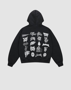 The LFDY Logo Hooded Zip by LIVE FAST DIE YOUNG is a black oversized Baumwolle sweatshirt, displayed flat, featuring bold white multilogo graphics and artistic phrases like Live Fast and Río Pyro printed across the back. | plain