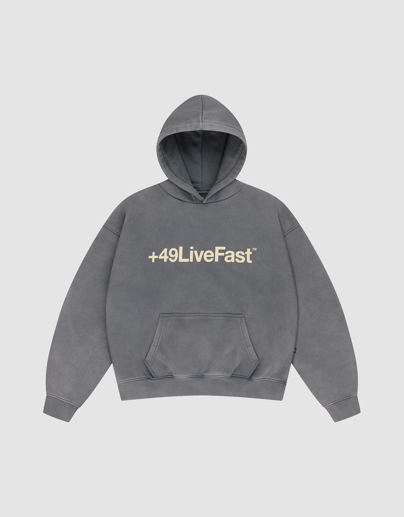 The Basic +49 Hooded by LIVE FAST DIE YOUNG is a faded gray oversized hoodie with a front pocket and large light +49LiveFast™ print across the chest, crafted from soft Baumwolle for all-day comfort.
