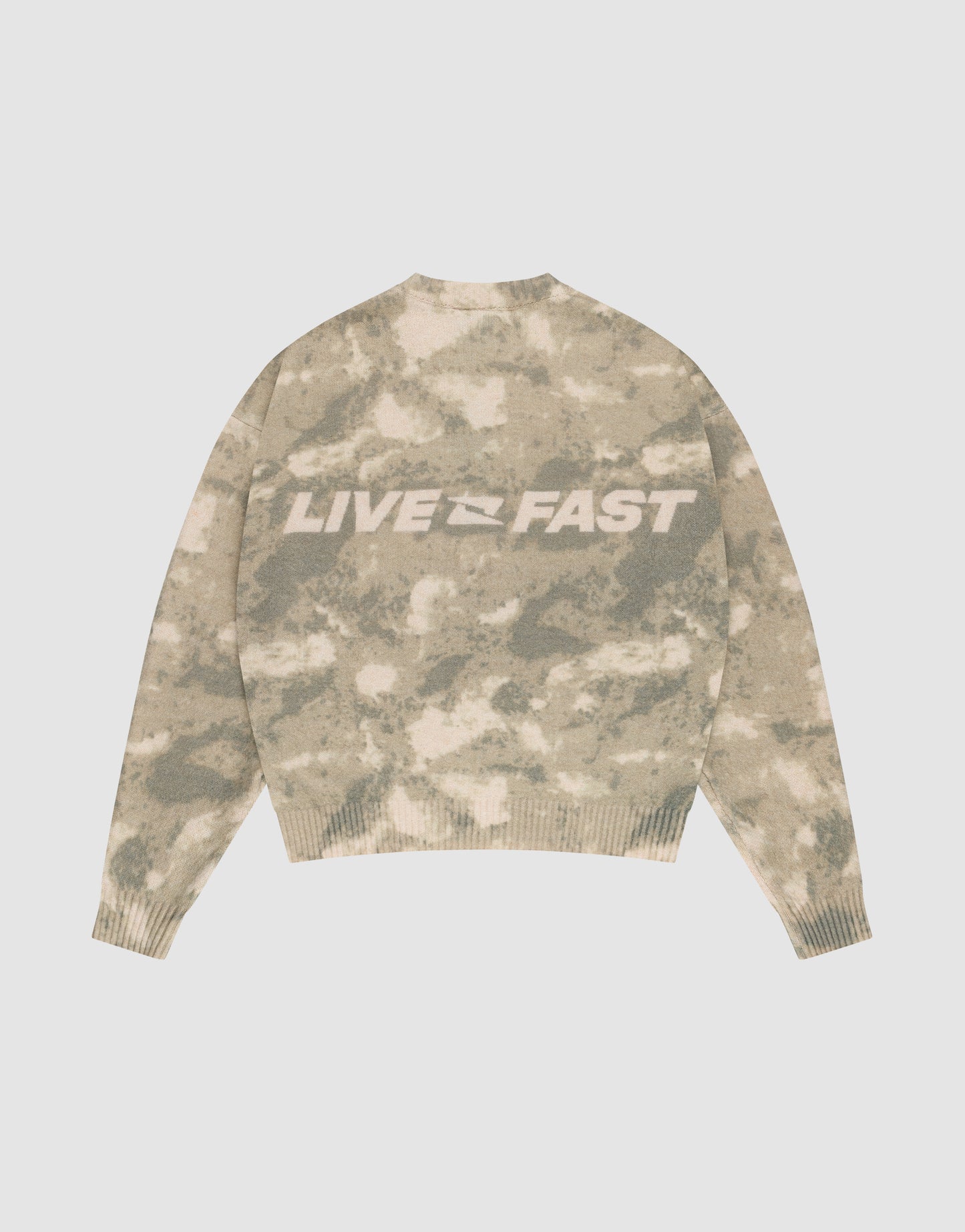 The Live Fast Boucle Sweater by LIVE FAST DIE YOUNG features a beige and light brown camo pattern, an oversized fit, and bold white "LIVE FAST" lettering on the back.