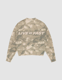 The Live Fast Boucle Sweater by LIVE FAST DIE YOUNG features a beige and light brown camo pattern, an oversized fit, and bold white "LIVE FAST" lettering on the back. | plain