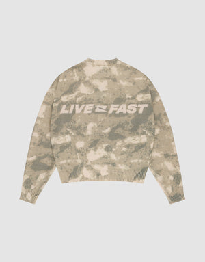 The Live Fast Boucle Sweater by LIVE FAST DIE YOUNG features a beige and light brown camo pattern, an oversized fit, and bold white "LIVE FAST" lettering on the back. | plain