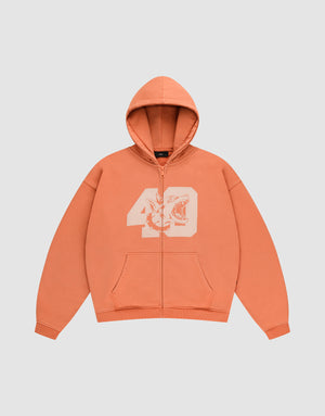 The LFDY 40 Hooded Zip by LIVE FAST DIE YOUNG is an orange oversized zip-up hoodie with front pockets and a bold white bleich-print: number 49 intertwined with a striking tiger face on the chest. | plain