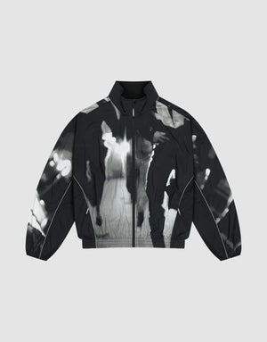 The LFDY Performance Jacket by LIVE FAST DIE YOUNG features a black and white zip-up nylon design with a high collar and abstract tie-dye-style allover print on a gray background. | plain