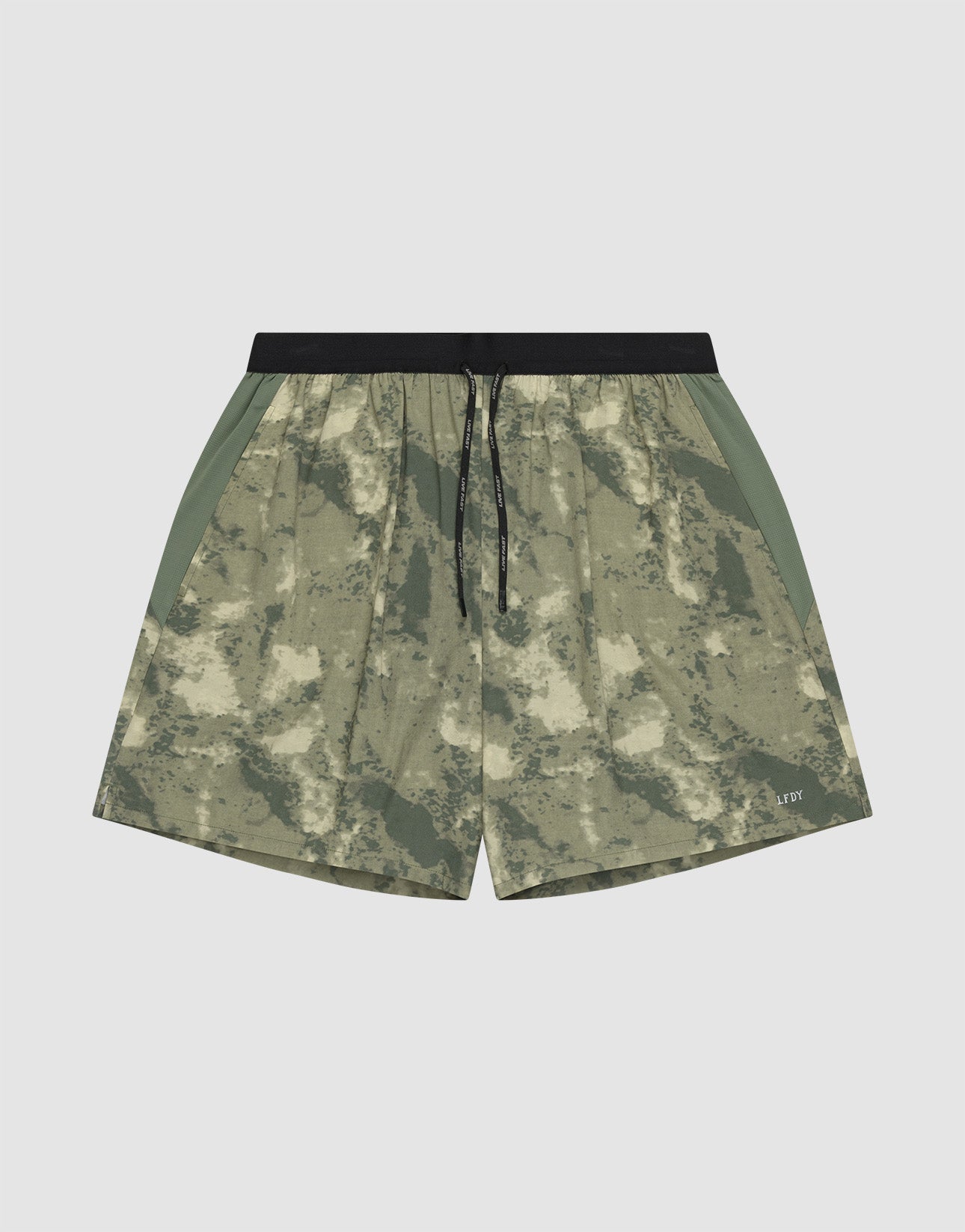 The LFDY Performance Running Shorts by LIVE FAST DIE YOUNG feature a green and beige camo pattern, integrated tights, black drawstring waistband, side panels, and a practical phone pocket, shown against a plain white background.