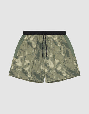 The LFDY Performance Running Shorts by LIVE FAST DIE YOUNG feature a green and beige camo pattern, integrated tights, black drawstring waistband, side panels, and a practical phone pocket, shown against a plain white background. | plain