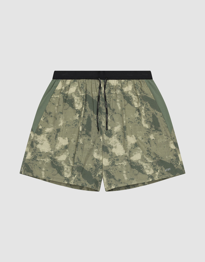 The LFDY Performance Running Shorts by LIVE FAST DIE YOUNG feature a green and beige camo pattern, integrated tights, black drawstring waistband, side panels, and a practical phone pocket, shown against a plain white background. | plain