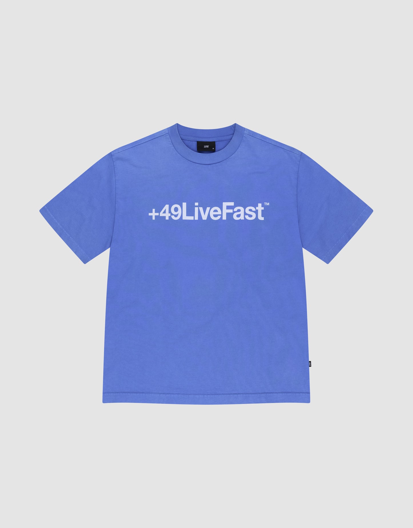 The Basic +49 Tee by LIVE FAST DIE YOUNG is a blue oversized short-sleeve shirt, laid flat, with a bold white +49LiveFast™ print across the chest.