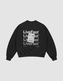 The Basic Evidence Sweater by LIVE FAST DIE YOUNG is a black oversized sweatshirt with "Live Fast" printed four times in bold white on the back, front and back prints, a white tag over the print, and made from comfortable cotton-polyester blend. | plain