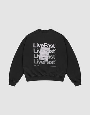The Basic Evidence Sweater by LIVE FAST DIE YOUNG is a black oversized sweatshirt with "Live Fast" printed four times in bold white on the back, front and back prints, a white tag over the print, and made from comfortable cotton-polyester blend. | plain