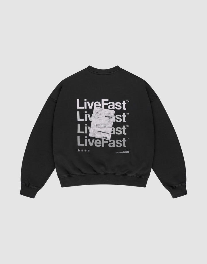 The Basic Evidence Sweater by LIVE FAST DIE YOUNG is a black oversized sweatshirt with "Live Fast" printed four times in bold white on the back, front and back prints, a white tag over the print, and made from comfortable cotton-polyester blend. | plain