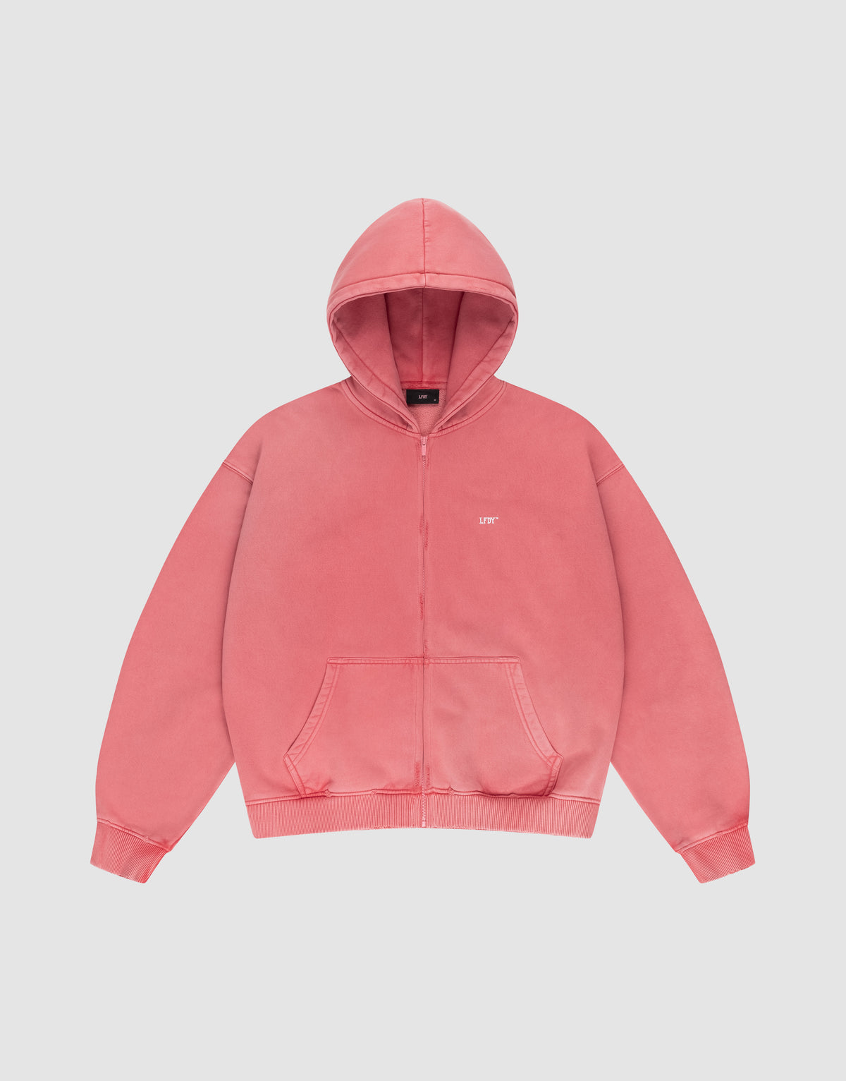 The LIVE FAST DIE YOUNG Basic Hooded Zip is a coral pink oversized zip-up hoodie with front pockets, a hood, and small white UPT text on the left chest, displayed on a plain white background. | plain