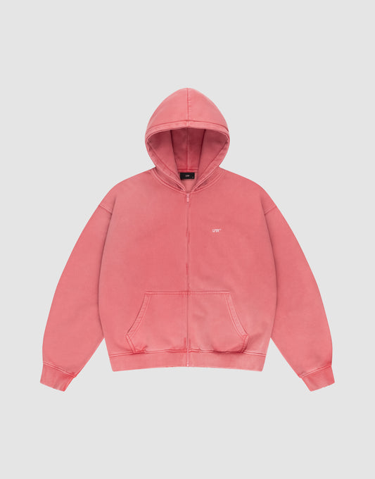 The LIVE FAST DIE YOUNG Basic Hooded Zip is a coral pink oversized zip-up hoodie with front pockets, a hood, and small white UPT text on the left chest, displayed on a plain white background. | plain