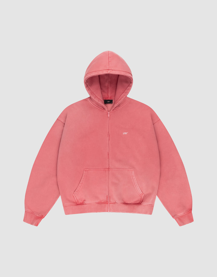 The LIVE FAST DIE YOUNG Basic Hooded Zip is a coral pink oversized zip-up hoodie with front pockets, a hood, and small white UPT text on the left chest, displayed on a plain white background. | plain