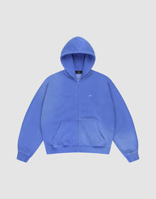 The LIVE FAST DIE YOUNG Basic Hooded Zip is a blue, oversized zip-up hoodie with a hood, front pockets, subtle LFTS text on the left chest, and a faded look, shown against a plain white background. | plain