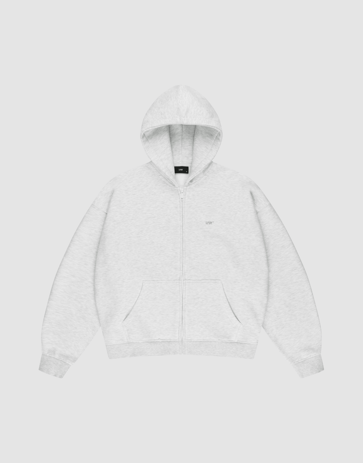 The LIVE FAST DIE YOUNG Basic Hooded Zip is a light gray zip-up hoodie with an oversize fit, front pockets, and a hood. It features subtle LFDY branding on the chest and is shown laid flat on a plain white background. | plain