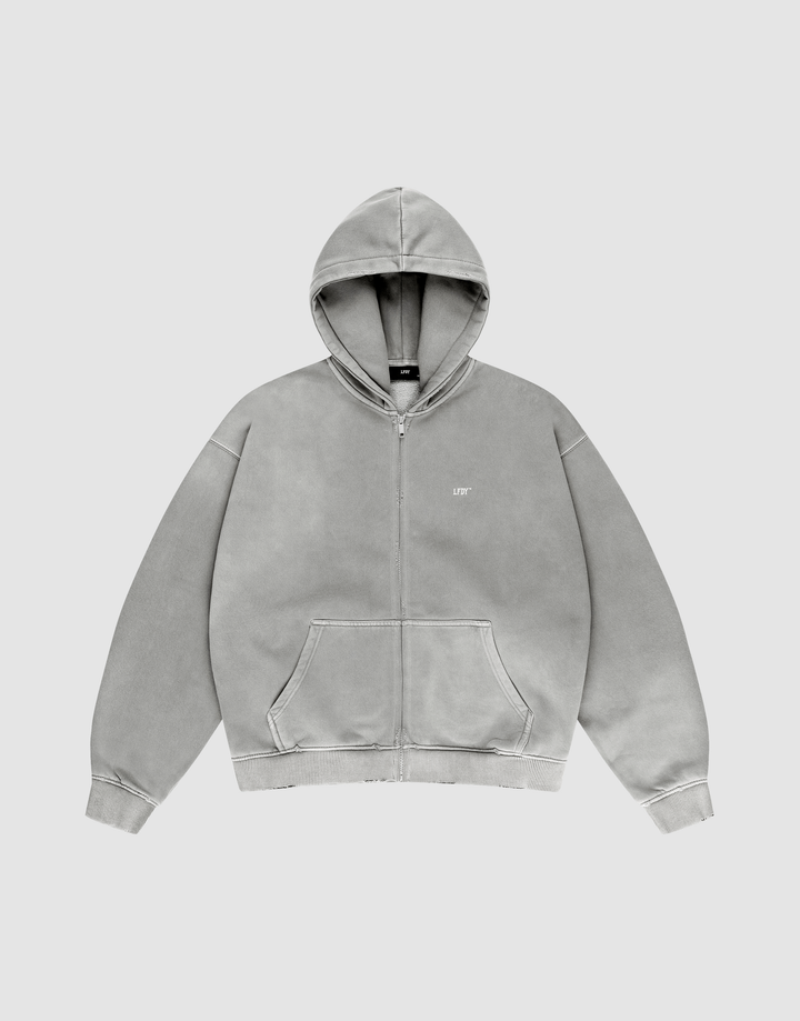 The LIVE FAST DIE YOUNG Basic Hooded Zip is a light gray zip-up hoodie with a hood, front pockets, and a small LIFT logo on the left chest, shown on a matching gray background. | plain
