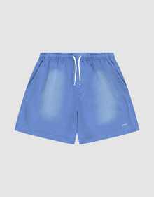The LIVE FAST DIE YOUNG Basic Sweat Shorts are blue with a faded finish, elastic waistband, white drawstring, angled side pockets, and a small white logo on the lower left leg, shown against a light gray background. | plain