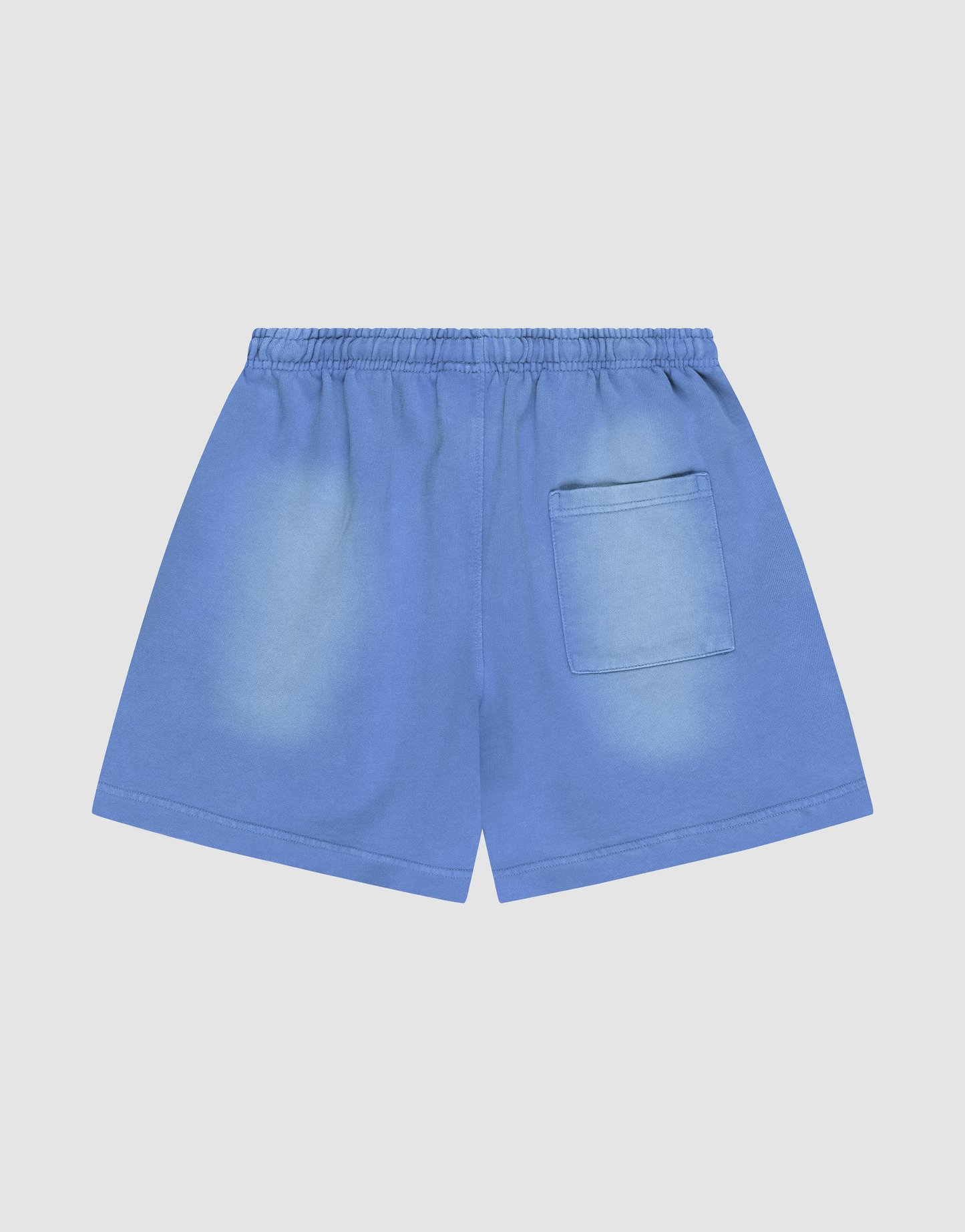 LIVE FAST DIE YOUNG Basic Sweat Shorts in blue, featuring an elastic waistband, single right back pocket, and oversized fit for comfort. The fabric has lightly faded areas for a relaxed, worn-in style and is showcased on a plain light background.