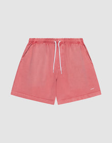 The LIVE FAST DIE YOUNG Basic Sweat Shorts in coral pink feature side pockets, a white drawstring waistband, and a subtle logo on the lower left leg, shown flat on a light background for a minimalist look. | plain