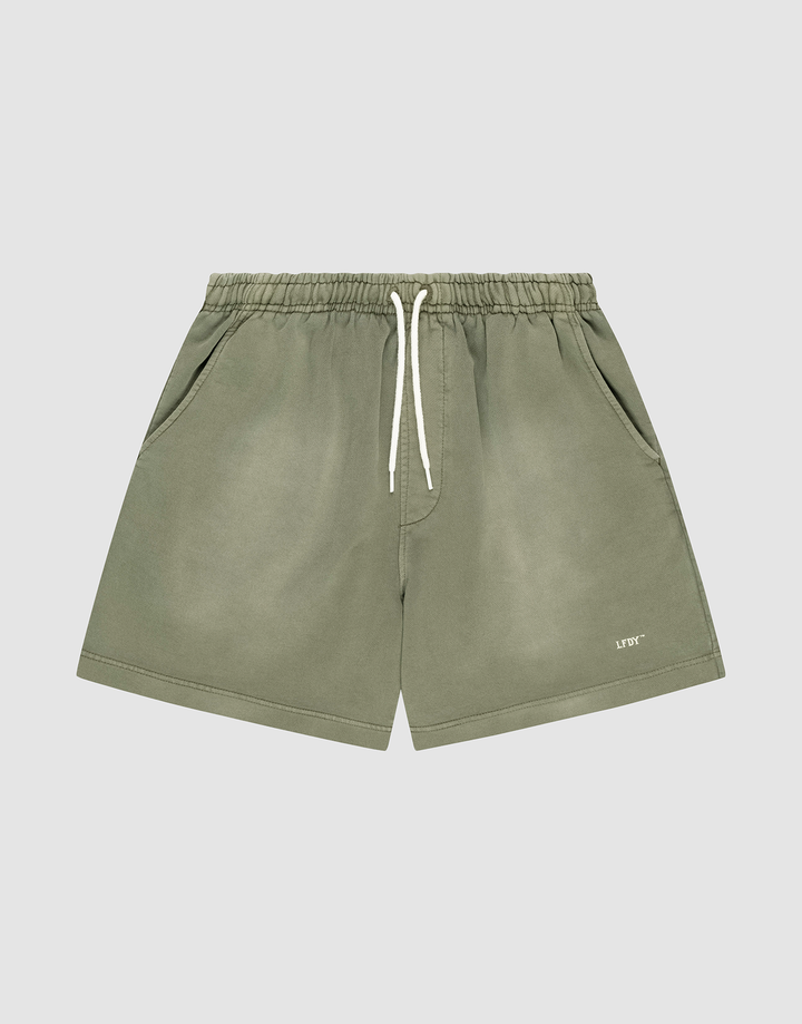 LIVE FAST DIE YOUNG Basic Sweat Shorts in olive green with an elastic waistband, white drawstring, side pockets, oversized fit, subtle faded look, and "LIFTO" logo on the left leg. Shown on a plain light grey background. | plain