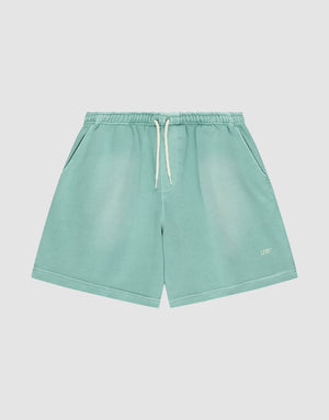 LIVE FAST DIE YOUNG Basic Sweat Shorts in light teal, featuring an elastic waistband, side pockets, and a white “LFT” logo on the bottom left leg, shown against a plain white background. | plain