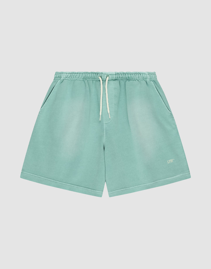 LIVE FAST DIE YOUNG Basic Sweat Shorts in light teal, featuring an elastic waistband, side pockets, and a white “LFT” logo on the bottom left leg, shown against a plain white background. | plain
