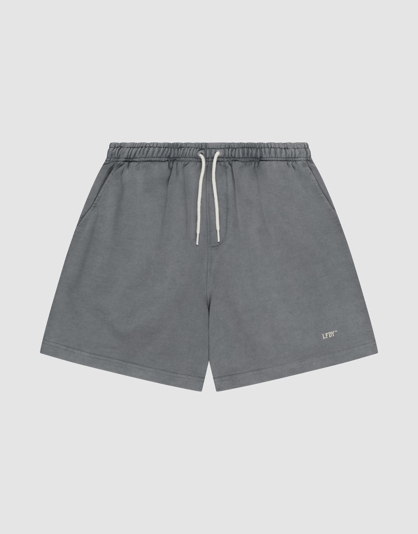 LIVE FAST DIE YOUNG Basic Sweat Shorts in gray with an elastic waistband, side pockets, and a small “LIFT” logo print on the lower left leg, shown against a plain light background.