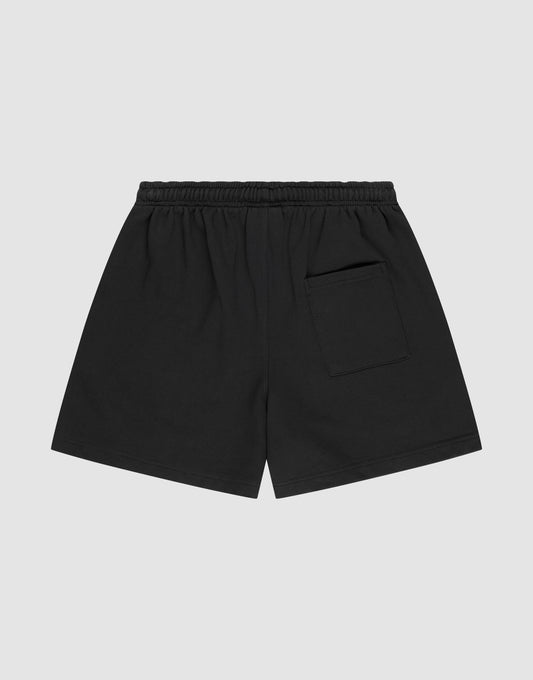 LIVE FAST DIE YOUNG Basic Sweat Shorts in black with an elastic waistband, single back pocket, and subtle logo print, shown flat on a light gray background.