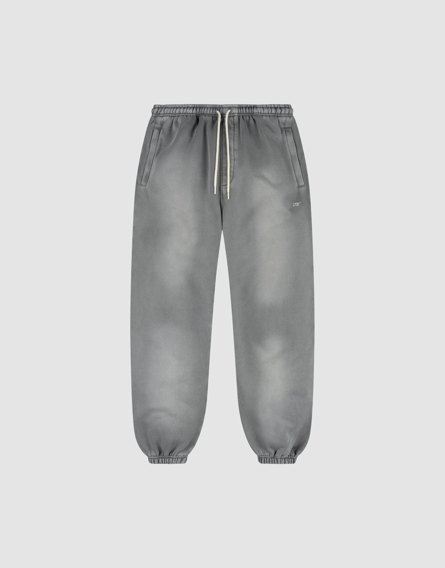 The LIVE FAST DIE YOUNG Basic Loose Jogger is a pair of gray washed sweatpants with a subtle fade effect, elastic waistband and white drawstring, side pockets, and elastic ankle cuffs, shown on a plain light background.