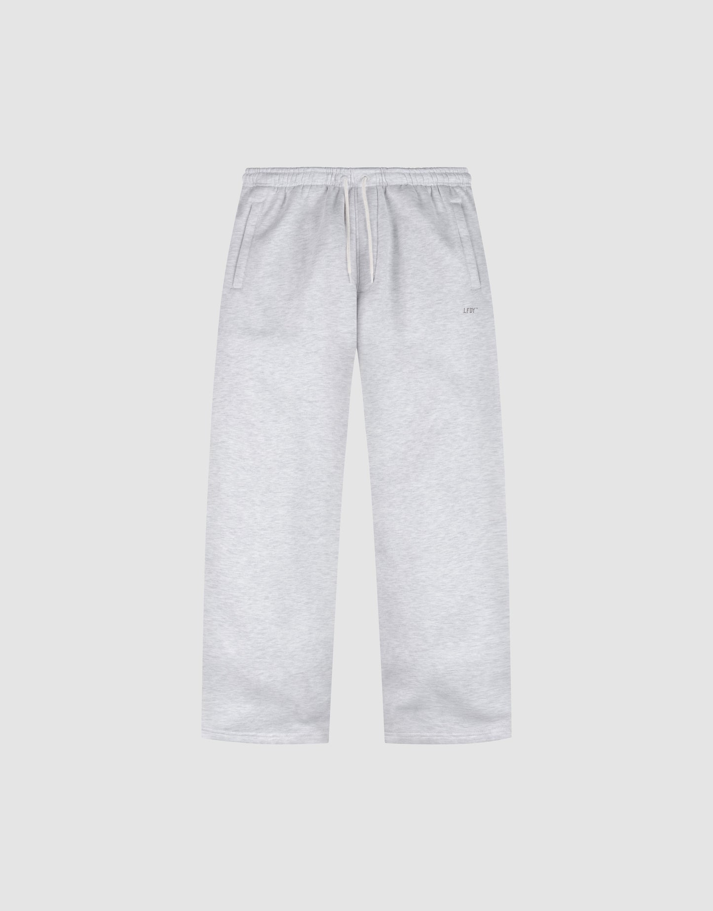 The Basic Wide Jogger by LIVE FAST DIE YOUNG features a light grey color, oversized fit, elastic waistband with drawstring, and side pockets, shown laid flat on a plain white background.