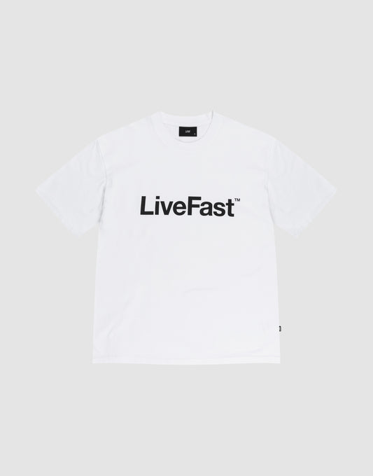 The Basic LiveFast Tee by LIVE FAST DIE YOUNG is a Regular Fit plain white T-shirt featuring a bold black "LiveFast™" front print, laid flat on a light gray background. Crafted from 100% Baumwolle for comfort and style. | plain