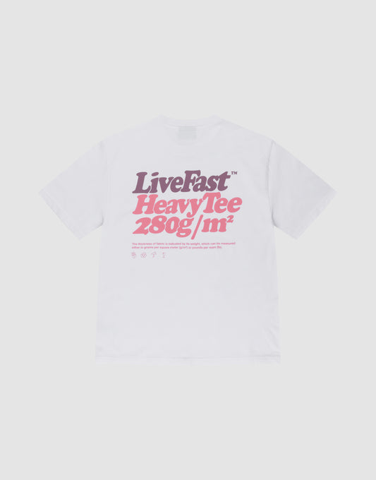 The LIVE FAST DIE YOUNG Basic 280 Tee is a white oversize fit t-shirt with a bold purple and pink “LiveFast HeavyTee 280g/m²” backprint, plus icons and text below. Made from 100% Baumwolle, shown on a plain light background. | plain