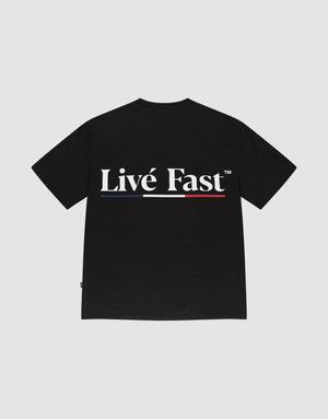 The Live Fast Paris Tee by LIVE FAST DIE YOUNG is a black regular fit T-shirt made from 100% Baumwolle with Livé Fast™ in bold white letters and a red underline on the back, showcasing distinctive front and back prints. | plain