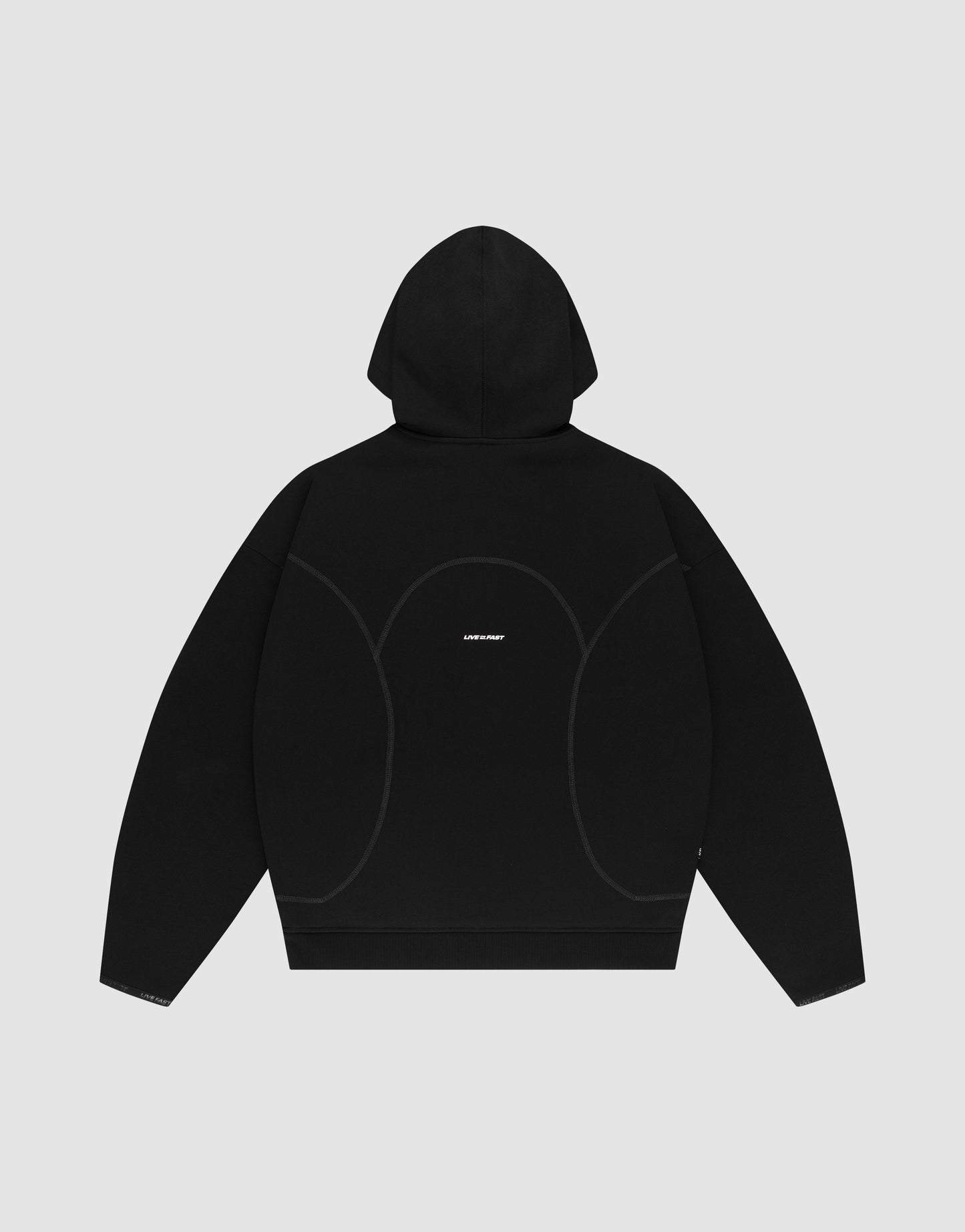 The LIVE FAST DIE YOUNG LFDY Active Fleece Hooded Zip in black is shown laid flat, back facing up, highlighting subtle gray seams and a small white logo on the upper back against a light gray background.
