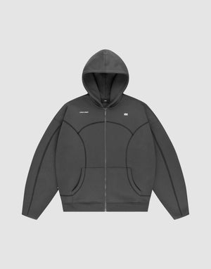 The LFDY Active Fleece Hooded Zip by LIVE FAST DIE YOUNG is a dark gray, oversized zip-up hoodie with a hood, subtle seam details, and a small white logo on the chest, shown against a plain light gray background. | plain