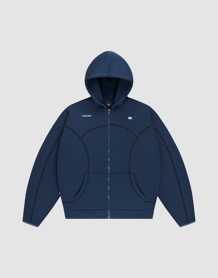 The LFDY Active Fleece Hooded Zip by LIVE FAST DIE YOUNG is a navy oversized zip-up hoodie with a hood, front pockets, black curved seams, and a small white chest logo, made from premium Baumwolle and shown on a light gray background. | plain
