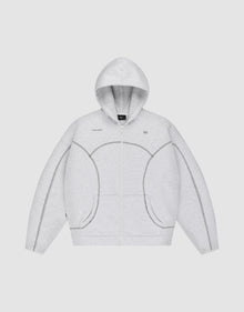 The LFDY Active Fleece Hooded Zip by LIVE FAST DIE YOUNG is a light gray oversized zip-up hoodie in 100% Baumwolle, featuring a hood, front pockets, and dark gray stitched seams outlining unique curved and straight patterns. | plain