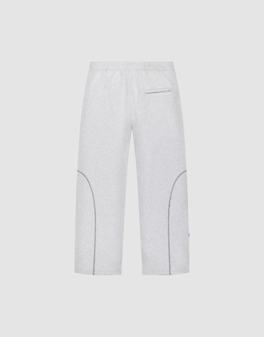 The LFDY Active Fleece Jogger by LIVE FAST DIE YOUNG features a wide fit, elastic waistband, zippered back pocket, curved lower leg seams, and a subtle logo print, shown against a plain white background.